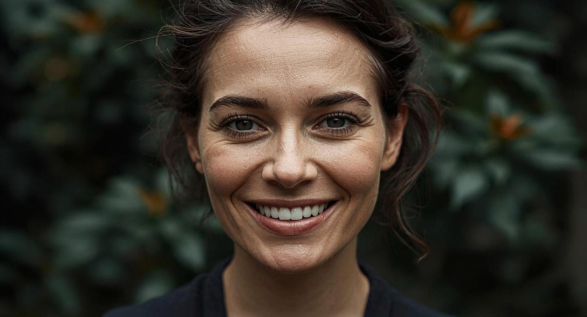 Woman with clear skin representing the benefits of copper tongue scraping as part of a daily detox morning ritual